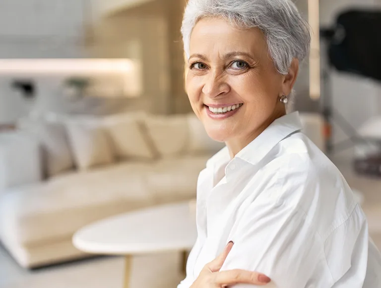 Patient maintaining 3 on 6&trade; dental implants with a water flosser